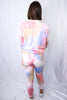 Brunette models long sleeve and pant tie dye loungewear set for Scarlette The Label, an online fashion boutique for women.