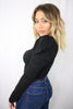 Load image into Gallery viewer, Blonde girl models a long sleeve bodysuit in black for Scarlette The Label, an online fashion boutique for women. The black bodysuit has puff sleeves. Paired with dark denim jeans.
