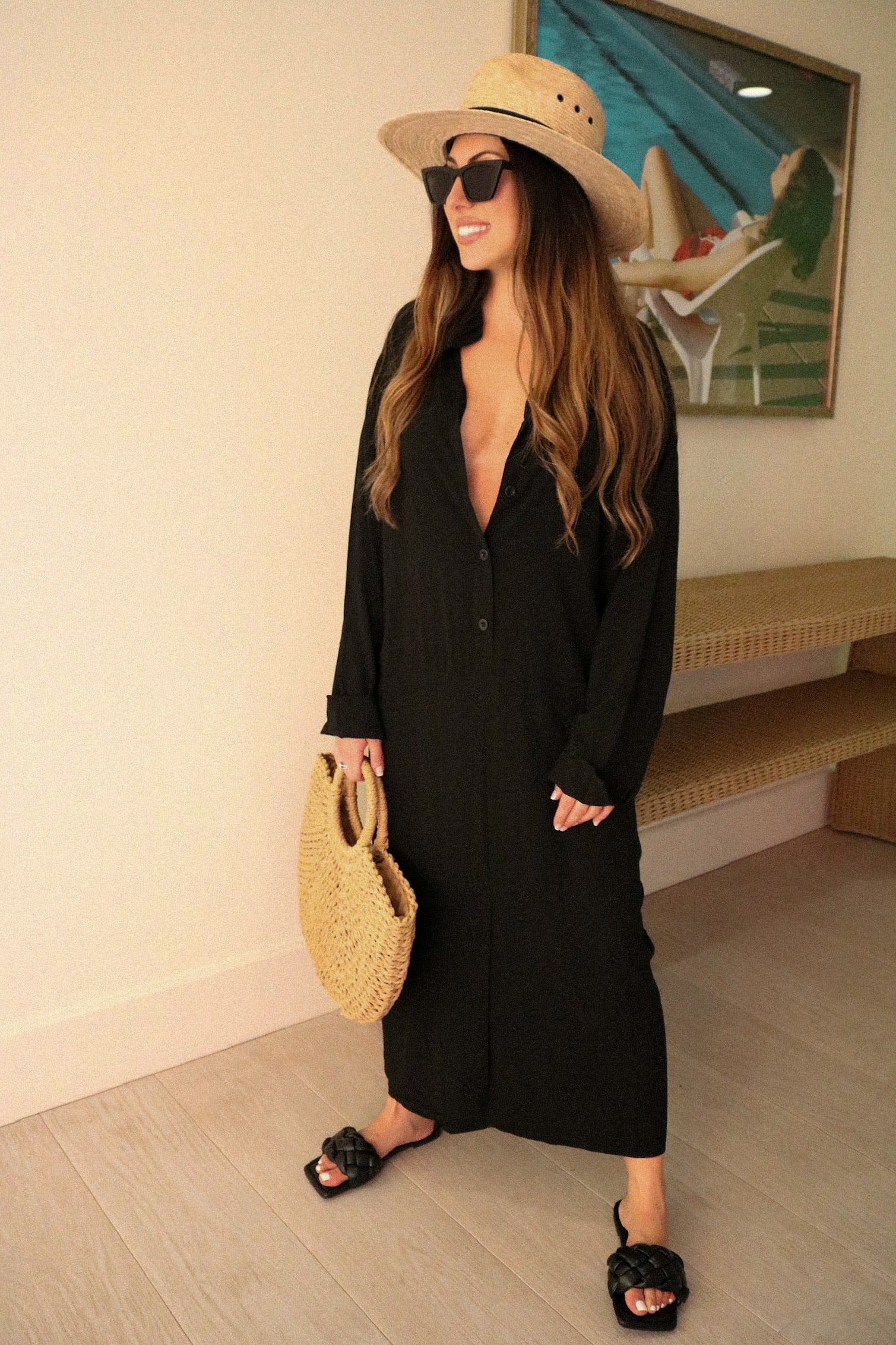 Buttoned T-Shirt Cover Up Dress in Black for Scarlette The Label, an online fashion boutique for women. Paired with a large straw handbag and a wide brimmed hat. Staycation Collection SS 2021