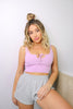 Load image into Gallery viewer, Blonde girl models the Namaste Home Loungewear Collection set for Scarlette The Label, an online fashion boutique for women. The set includes a soft lilac crop top and gray loungewear shorts. Sold separately.