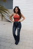 Load image into Gallery viewer, Ribbed Halter Top in Terra Cotta with V detail at Scarlette The Label, an online fashion boutique for women. Paired with dark denim jeans.