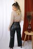 Load image into Gallery viewer, Blonde girl models long sleeve plunge cardigan crop top in the color Mocha for Scarlette The Label, an online fashion boutique for women. Paired with faux leather black pants.