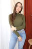 Load image into Gallery viewer, Brunette models long sleeve openback tie bodysuit in color olive for Scarlette The Label, an online fashion boutique for women. Paired with lightwash denim jeans and a gold chain belt. 