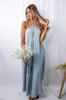 Blonde girl models a hi lo flowy, boxy jumpsuit in the color Gray for Scarlette The Label, an online fashion boutique for women