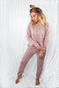 Load image into Gallery viewer, Blonde girl models matching jogger set for Scarlette The Label, an online fashion boutique for women. The knit jogger set (loungewear set) is in the color mauve and has long sleeves and matching long pants. The long pants have adjustable draw strings that allow for tightening or loosening fit.