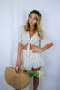 Load image into Gallery viewer, Blonde girl models a matching set for Scarlette The Label, an online fashion boutique for women. The set is a matching short set in white and charcoal stripes. Includes a short sleeve tie top and a skort. Paired with large straw bag.