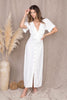 Load image into Gallery viewer, Short Sleeve Puff Sleeve buttoned maxi dress in white from Scarlette The Label, an online fashion boutique for women. Paired with gold hoops, gold clutch, and gold shoes.