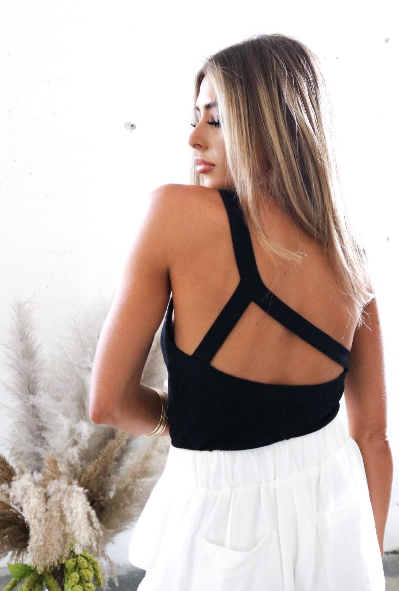 One Shoulder Crop Top with Triangle Back Design in Black. Scarlette The Label, an online fashion boutique for women. The Color Coded Collection.