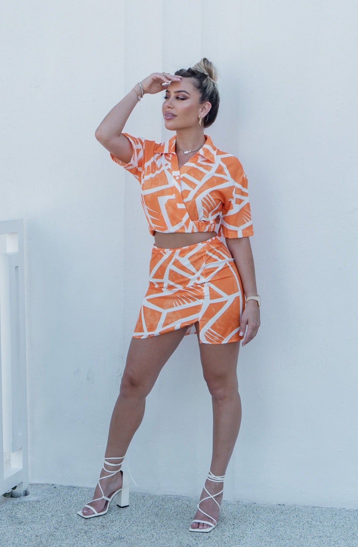 'Charlotte' Collared Button Down Cut Out Top and Mini Skirt Set in Orange Print. Scarlette The Label, an online fashion boutique for women.