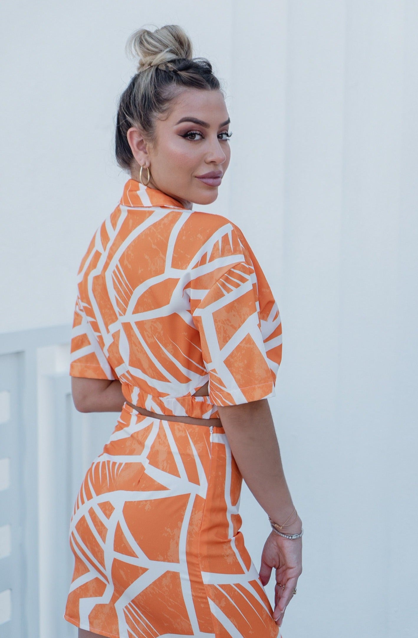 'Charlotte' Collared Button Down Cut Out Top and Mini Skirt Set in Orange Print. Scarlette The Label, an online fashion boutique for women.