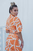Load image into Gallery viewer, &#39;Charlotte&#39; Collared Button Down Cut Out Top and Mini Skirt Set in Orange Print. Scarlette The Label, an online fashion boutique for women.