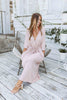 Load image into Gallery viewer, Blonde girl models a plunging neckline maxi dress in the color mauve for Scarlette The Label, an online fashion boutique for women. Plunging neckline maxi dress has adjustable waist strings.