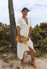 Load image into Gallery viewer, Short Sleeve Puff Sleeve buttoned maxi dress in white from Scarlette The Label, an online fashion boutique for women. Paired with gold hoops, gold clutch, and gold shoes.