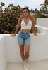 Criss Crop Crop Top Tank in Ivory from Scarlette The Label, an online fashion boutique for women. Paired with light wash denim jeans and gold hoops.